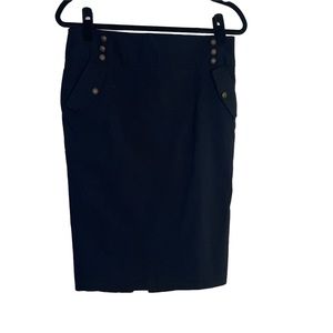 Black pencil skirt with gold decorative buttons and two side pockets.